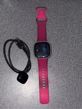 Fitbit versa 4 with Charging cable and extra bands